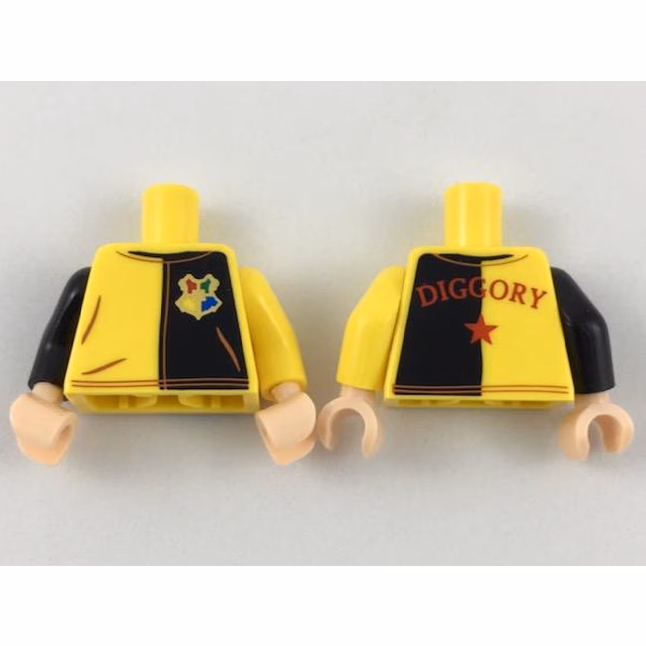 Torso Jersey with Black on Left with Hogwarts Crest, Red 'Diggory' and Star on Back Pattern / Yellow Arm Left / Black Arm Right / Light Nougat Hands Torso Jersey with Black on Left with Hogwarts Crest, Red 'Diggory' and Star on Back Pattern / Yellow Arm Left / Black Arm Right / Light Nougat Hands