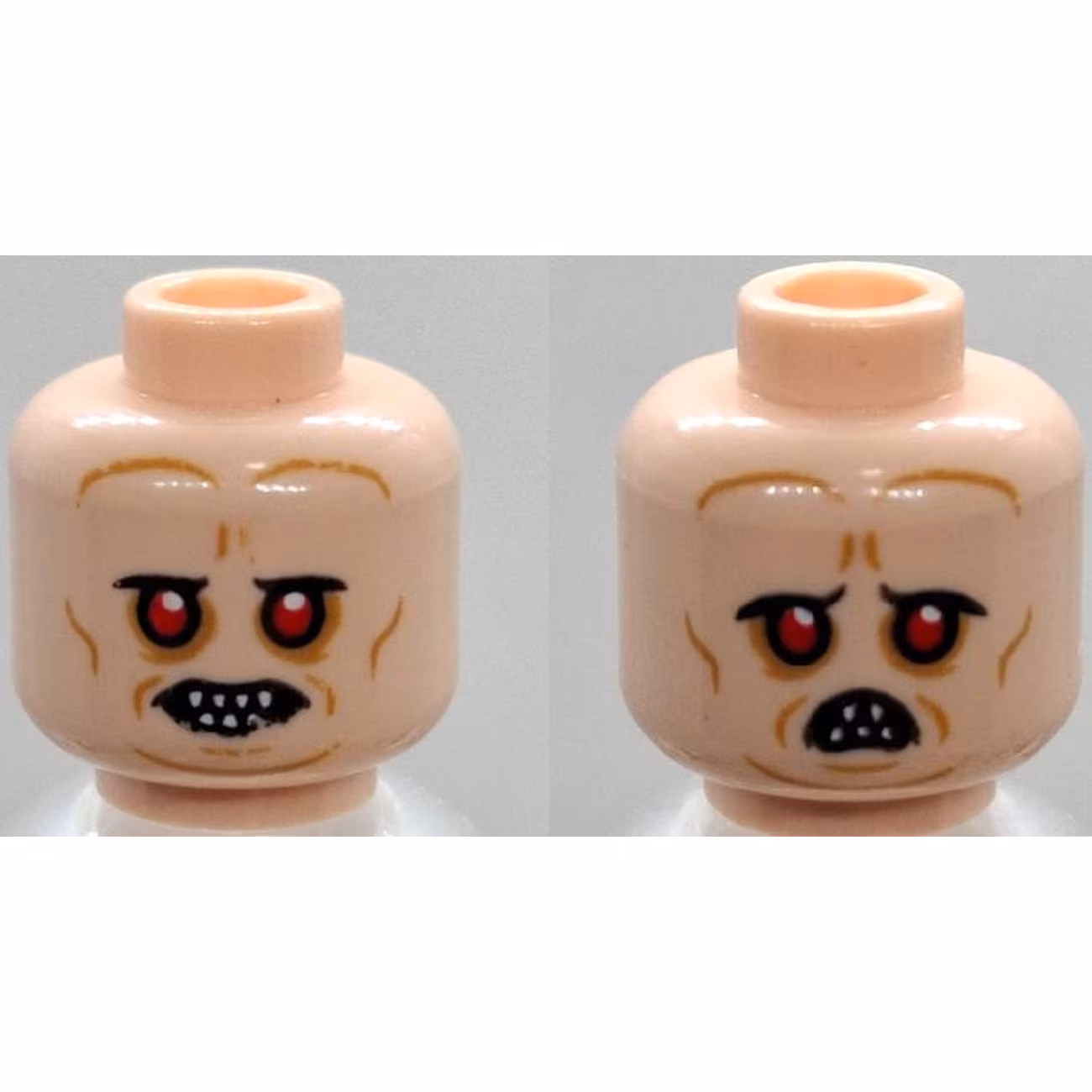 Minifigure, Head Dual Sided Alien with Red Eyes, Bared Pointed Teeth, Medium Nougat Wrinkles, Neutral / Frown with Narrow Open Mouth Pattern Minifigure, Head Dual Sided Alien with Red Eyes, Bared Pointed Teeth, Medium Nougat Wrinkles, Neutral / Frown with Narrow Open Mouth Pattern