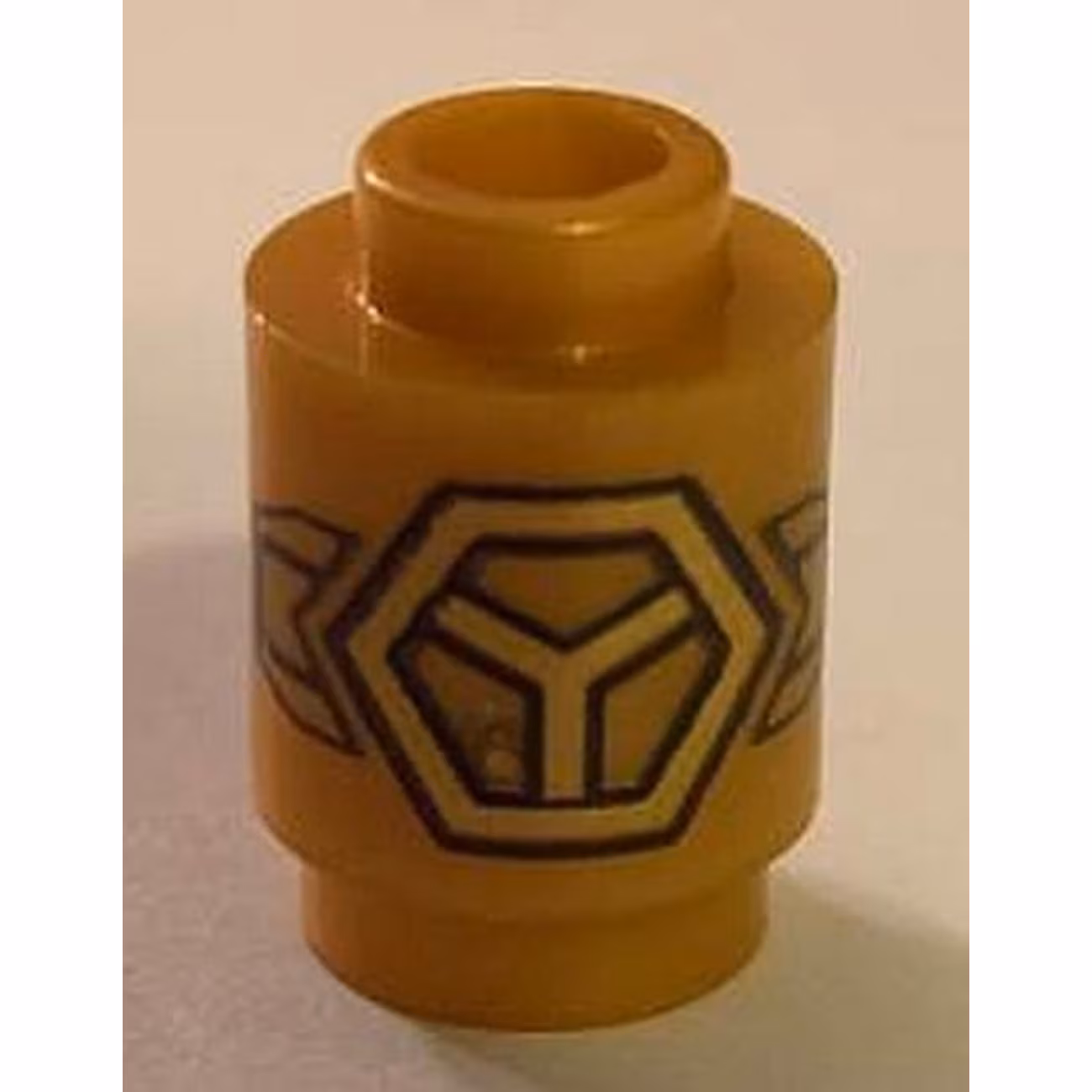 Brick, Round 1 x 1 with Gold Subdivided Hexagon and Wings Pattern Brick, Round 1 x 1 with Gold Subdivided Hexagon and Wings Pattern