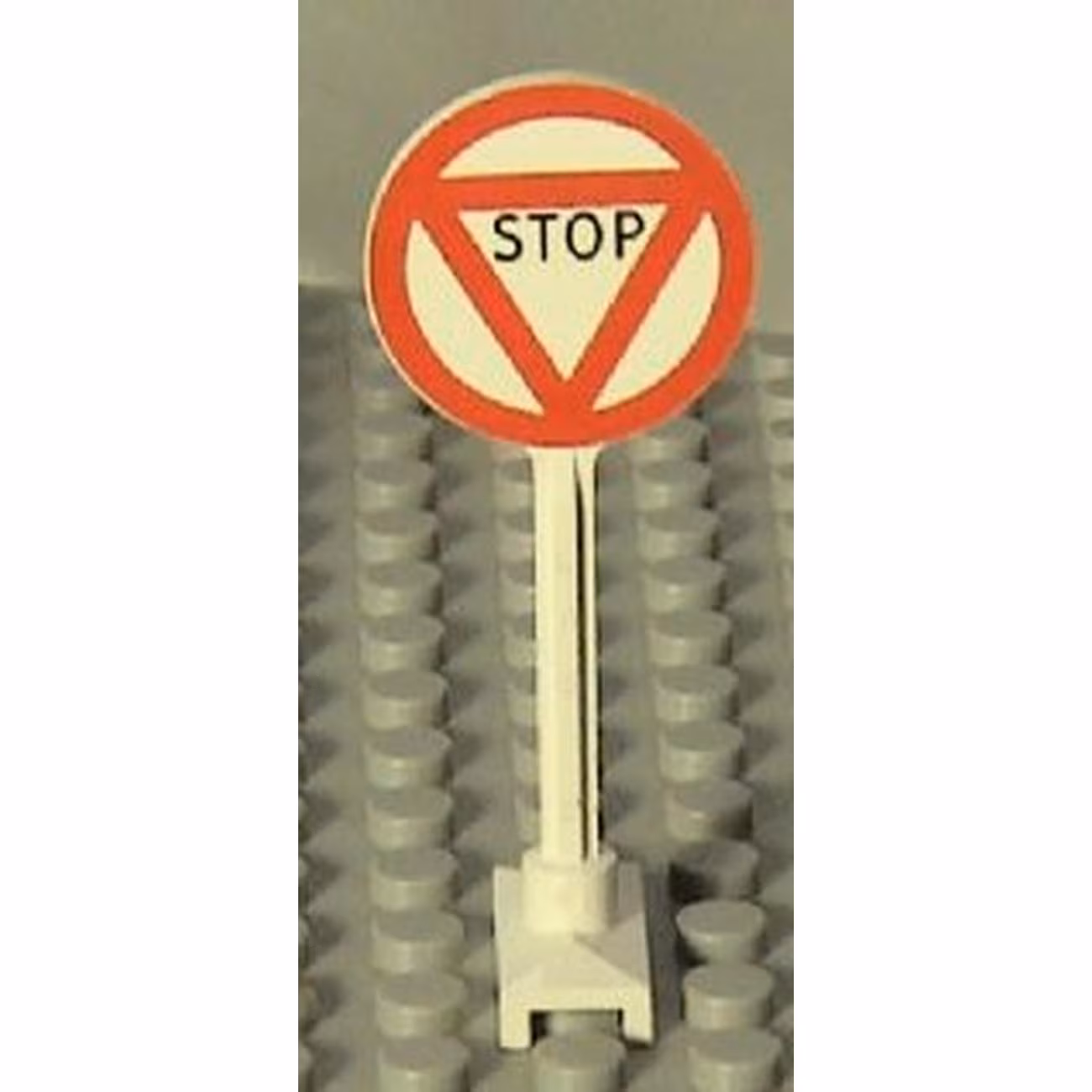 Road Sign Round with 'STOP' in Triangle Pattern Road Sign Round with 'STOP' in Triangle Pattern