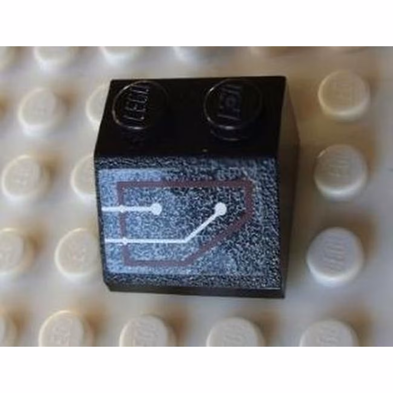 Slope 45 2 x 2 with Silver Circuitry, 1 Line Straight, 1 Line Bent in Red Outline Pattern (Sticker) - Set 7702 Slope 45 2 x 2 with Silver Circuitry, 1 Line Straight, 1 Line Bent in Red Outline Pattern (Sticker) - Set 7702