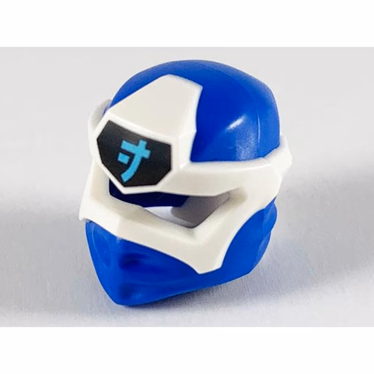 Minifigure, Headgear Ninjago Wrap Type 6 with Molded White Mask and Printed Medium Azure Ninjago Logogram Letter J on Black Background Pattern Minifigure, Headgear Ninjago Wrap Type 6 with Molded White Mask and Printed Medium Azure Ninjago Logogram Letter J on Black Background Pattern