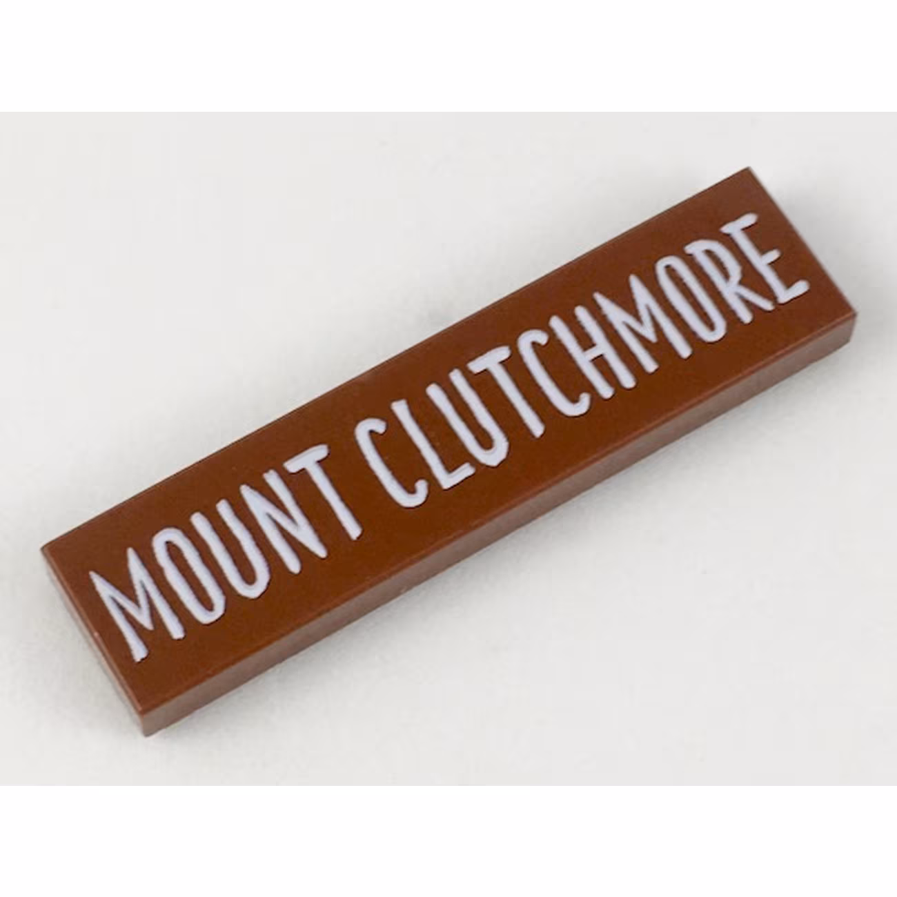 Tile 1 x 4 with White 'MOUNT CLUTCHMORE' Pattern Tile 1 x 4 with White 'MOUNT CLUTCHMORE' Pattern