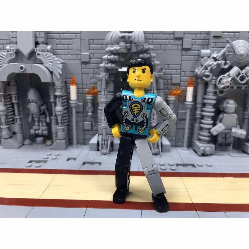 Technic Figure Black/Light Gray Legs, Dark Turquoise Torso with Yellow, Black, Silver Pattern, Light Gray Mechanical Left Arm