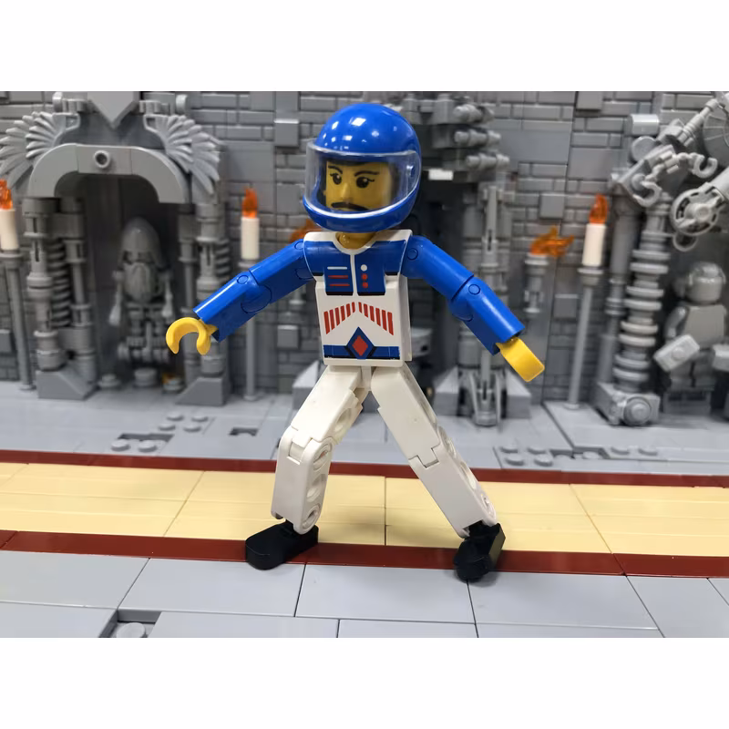 Technic Figure White Legs, White Top with Red Arrow-Type Stripes Pattern, Blue Arms, Blue Helmet