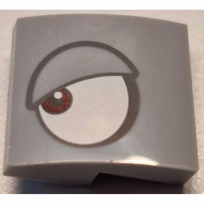 Slope, Curved 2 x 2 x 2/3 with White Eye, Dark Red Pupil and Dark Bluish Gray Outlined Eyelid Pattern Model Left Side (Super Mario Rambi)