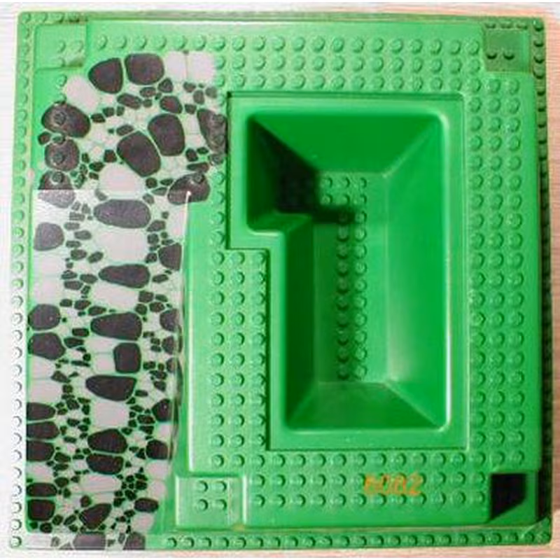 Baseplate, Raised 32 x 32 with Ramp and Pit with Black and Dark Gray Rocks Pattern