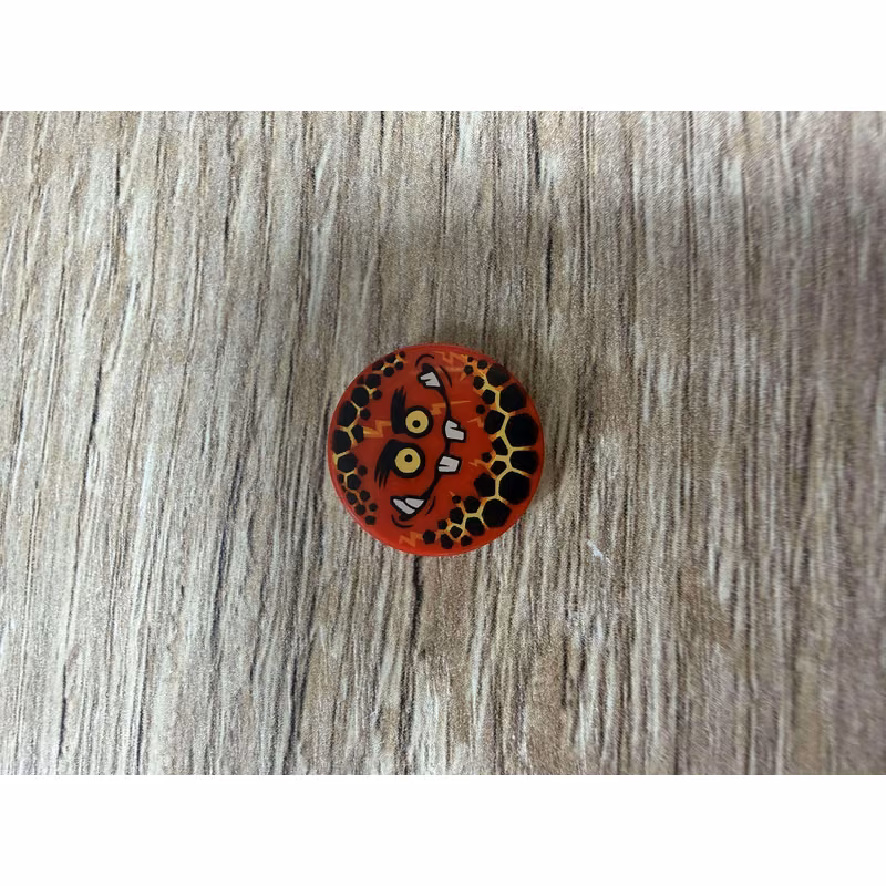 Tile, Round 2 x 2 with Bottom Stud Holder with Globlin Face with Small Teeth Pattern
